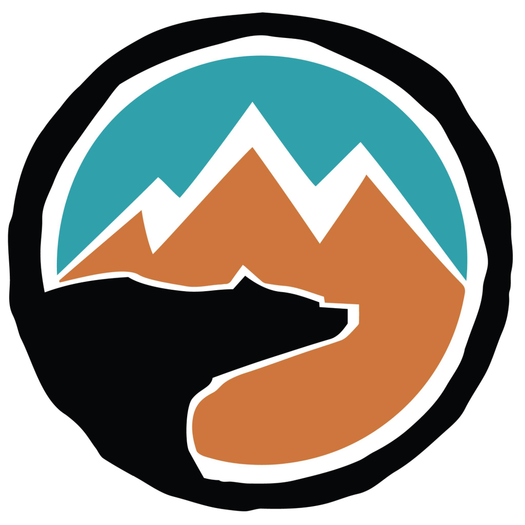 "Katmai Wilderness Lodge Logo bear in mountains design"