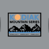A rectangular Kodiak Mountain Series logo features three black mountain peaks, a yellow sun, and blue sky. Text at the bottom lists Hetman 2,241 ft, Sharatin 2,689 ft, and Pyramid 2,395 ft.