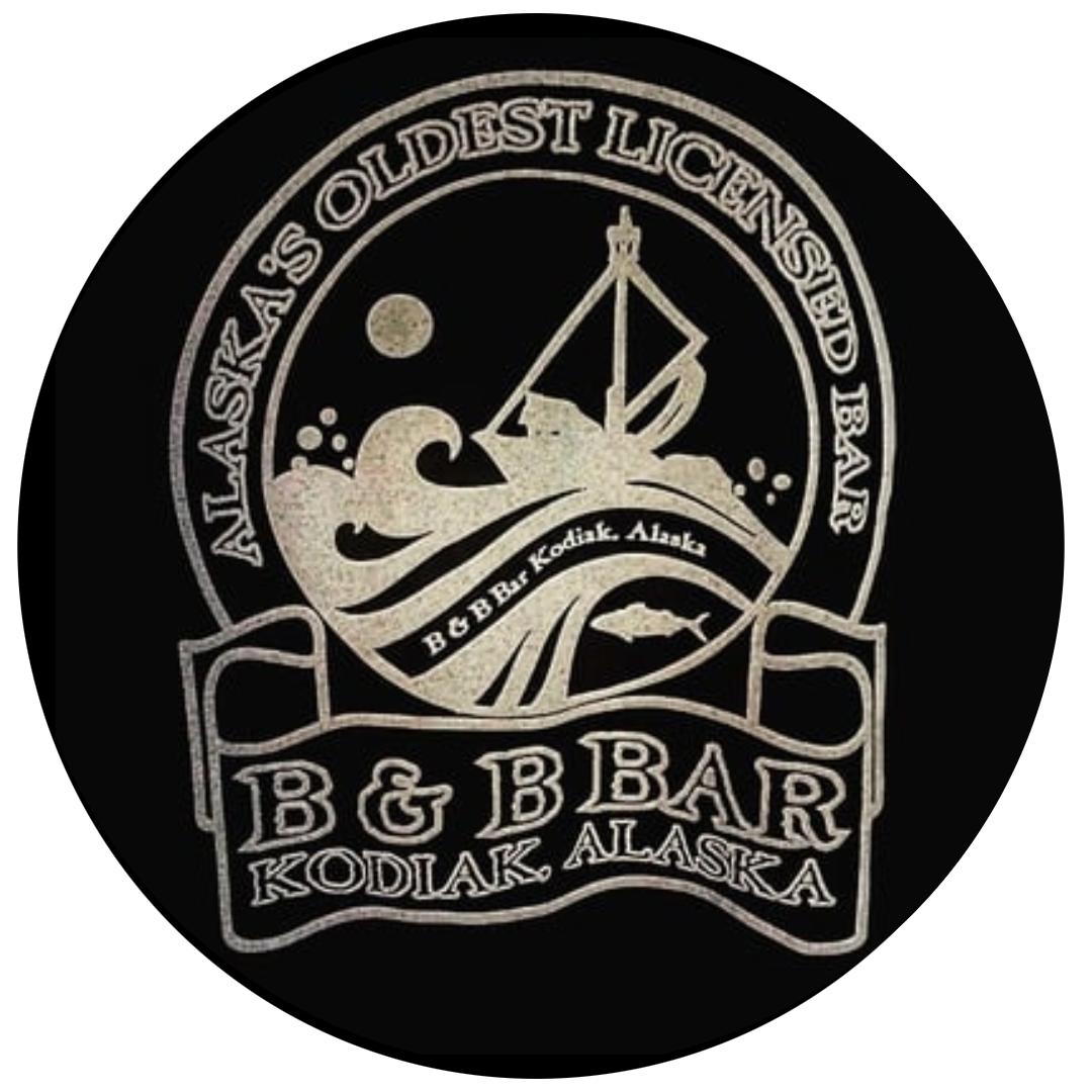 Circular logo for B B Bar in Kodiak, Alaska, with the text “Alaska’s Oldest Licensed Bar.” The design features a boat, waves, and a Kodiak island silhouette in the background on a black background.