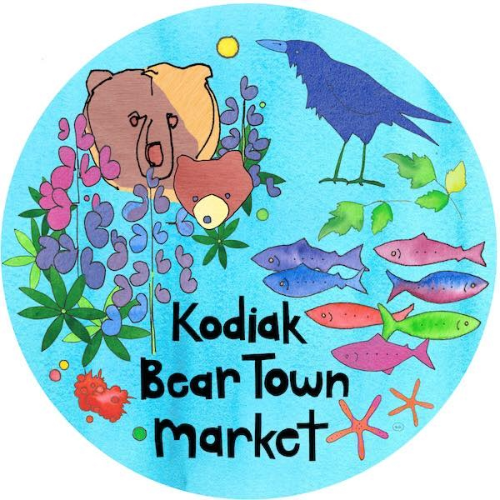 A circular illustration with a bear, a bear cub, a crow, purple flowers, colorful fish, sea stars, leaves, and “Kodiak Bear Town Market” written in black text on a blue background.