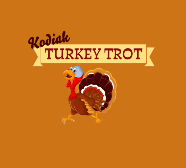 Illustration of a smiling turkey running beneath the text Kodiak Turkey Trot on a solid orange background with a yellow banner behind the words.